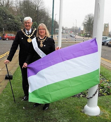 The Mayor and Mayoress before raising the suffragette flag to mark 100 years of women voting