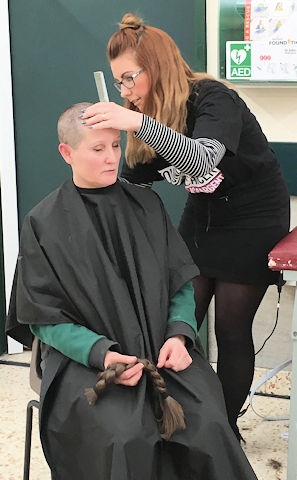 Bakery Manager Karen Knight having her hair shaved for CLIC Sargent