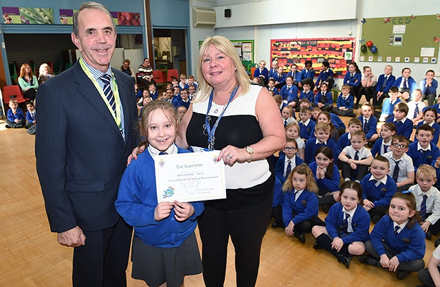 Councillor Kieran Heakin, Kelsie Parkinson with her eco superstar award and Karen Bracken, school business manager