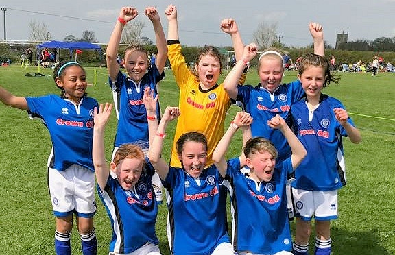 The girls celebrate their triumphant win