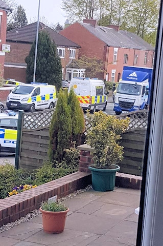 Police at the scene on Rochdale Road, Middleton