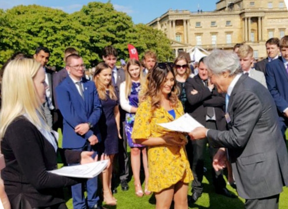 Sidrah Asim receives her Gold Duke of Edinburgh Award from John Suchet