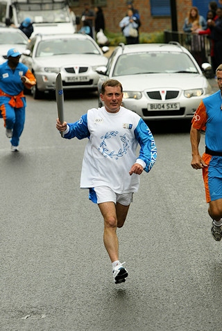 Andy carrying the Olympic torch in 2004