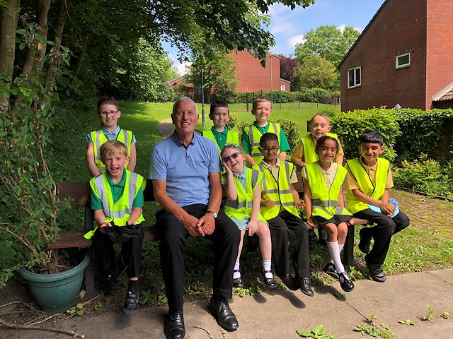 Jeff Whitworth with pupils from Shawclough Community Primary School