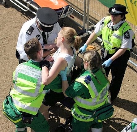 A young woman is treating for heat exhaustion