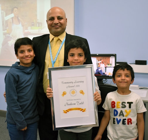 Nadeem Talib and his family accept his Community Learning Award