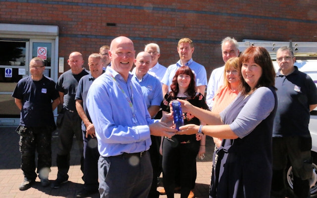 RBH repairs manager, Peter McHugh, receives the accreditation award from HQN’s Gill Stead