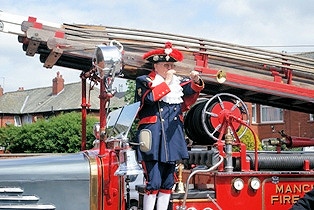 Official Blackpool Town Crier, Barry McQueen, arrives on a classic fire engine to officially open the event