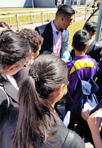 Muhammad Ali Zahid giving autographs to pupils