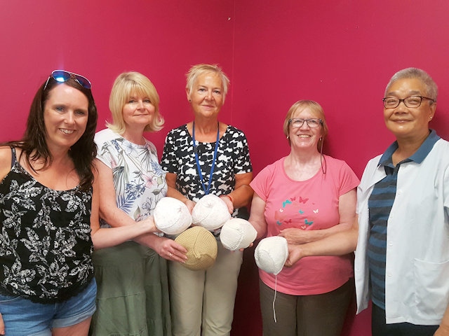 Carrol Booth with the Lighthouse Project Knit and Natter Group and their Knitted Knockers