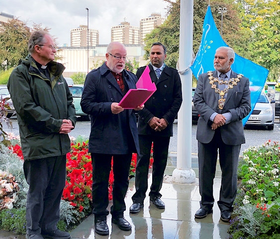 Steve Cooke speaks at the Flag Raising Ceremony for International Day of Peace