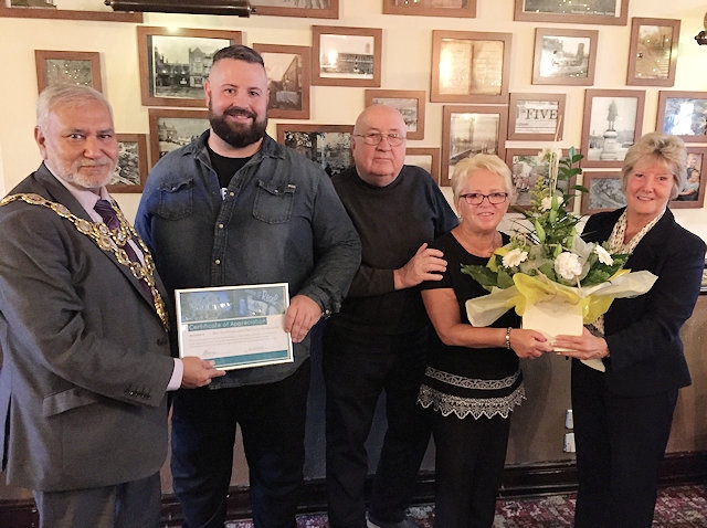 Mayor Mohammed Zaman presents Ben Boothman from the Flying Horse, with a Certificate of Appreciation