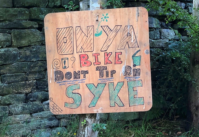 A sign warning people not to fly-tip on Syke