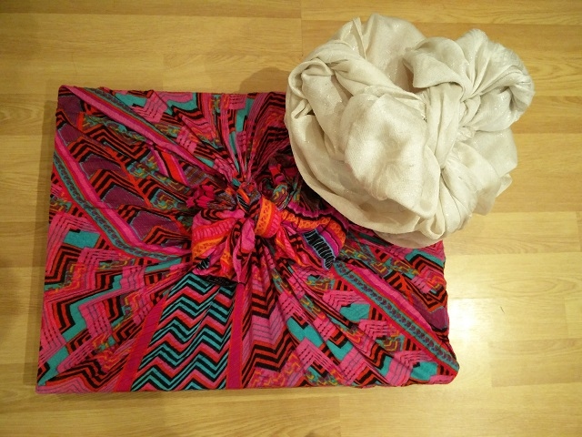 Presents using scarves to wrap the gifts, find the scarves from a charity shop, or use fabric