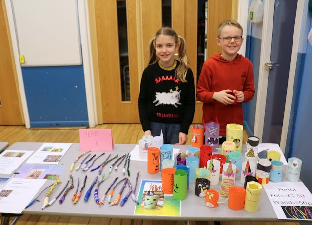 Year 6 pupils with some of the sale items