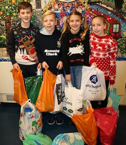 Year 6 pupils with some of the foodbank donations