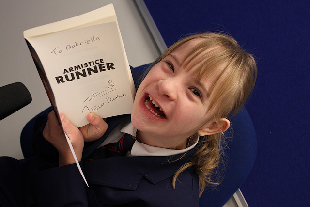 Gabriella Greenwood with her book personally signed by Tom Palmer.