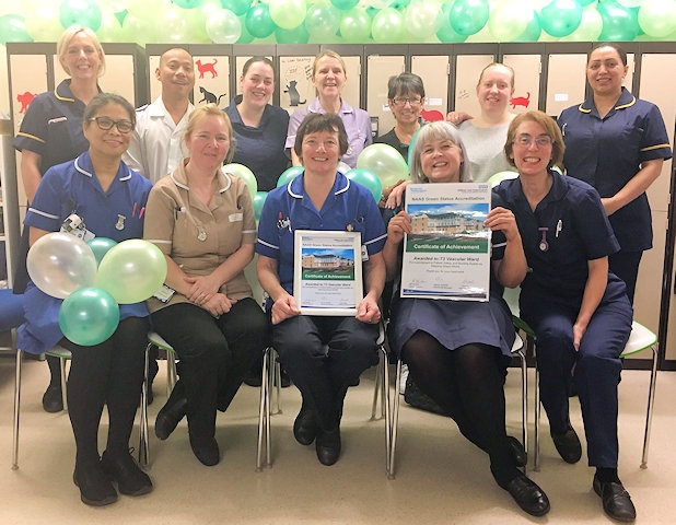 Staff from ward T3 at The Royal Oldham Hospital, showing their NAAS certificate