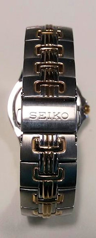 Silver-coloured Seiko bracelet wrist watch with gold features