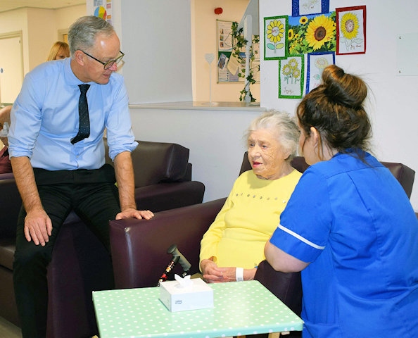 Steve Rumbelow speaking with patient Evelyn Alcock