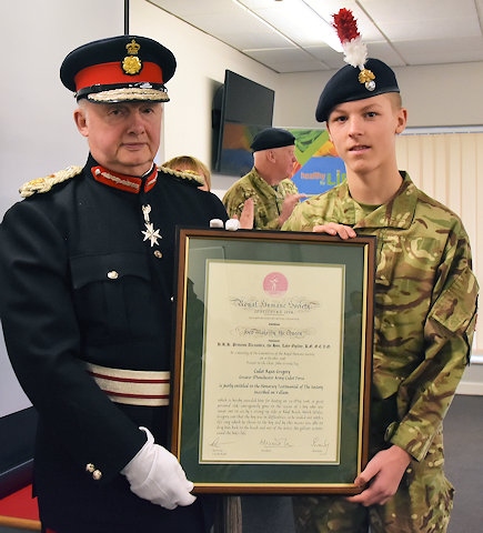 Lord Lieutenant of Greater Manchester, Mr Warren J. Smith KStJ DLitt LLD presents the Testimonial on Vellum Award from the Royal Humane Society to Cadet Ryan Gregory from Rochdale Detachment, 1 (Minden) Company