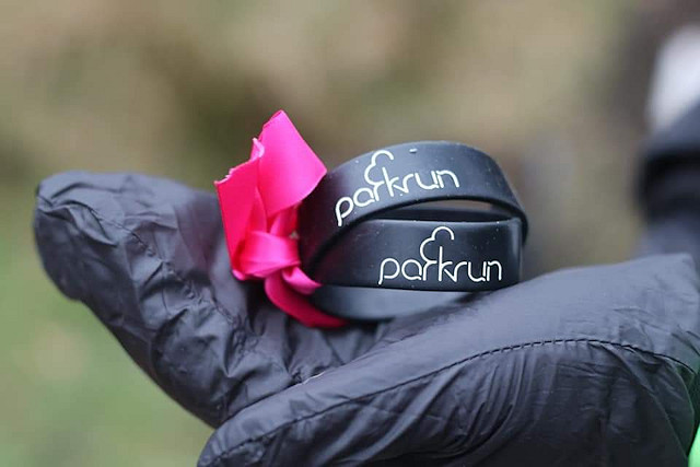 Garry also buried the parkrun wrist bands that they each wore under the tree, tied together with a pink ribbon