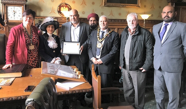 High Sheriff of Greater Manchester, Dr Robina Shah, presents Rochdale Council of Mosques with an Award of Commendation