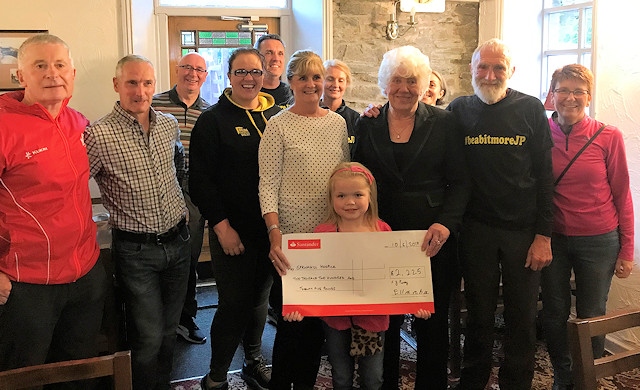 Ella Chadwick presents a cheque to Springhill Hospice