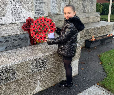 Children at St Luke's lay a wreath