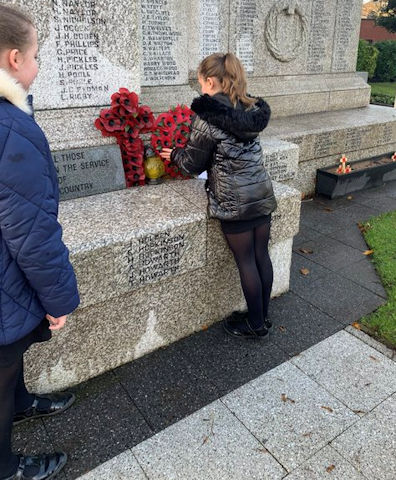 Children at St Luke's lay a wreath