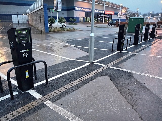 Electric vehicle charging posts on the car park of the Travelodge at Sandbrook Park