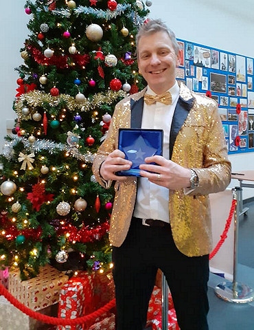 David Yates holding his BBC North West Tonight Christmas Star Award