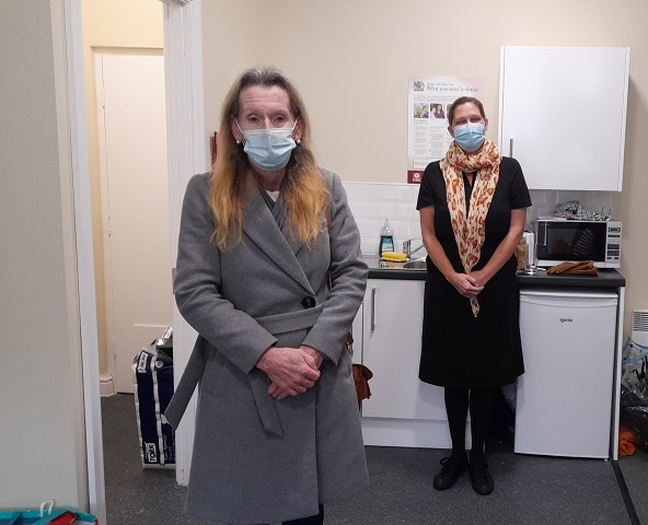 Elaine (grey coat) with Riverside's Eleanor Watts at the service