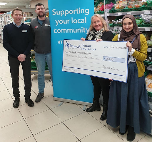 The cheque was presented by the two store managers, Chris Holt and Chris Lucas, and member pioneer, Bev Place to Sabba Razzaq from Rochdale and District Mind