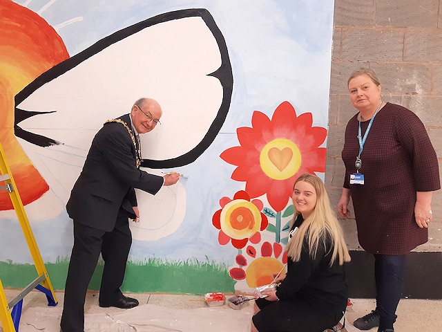 Courtney Booth, Student and Jane Bennett, Lecturer painted a butterfly mural at the Wheatsheaf Shopping Centre for 'Don't Be Blue Be You'