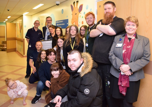 (Right to left): Royal Oldham Chief Officer and Director of Nursing, Nicola Firth with Oldham College Principal Alun Francis and Fine Art students from Oldham College