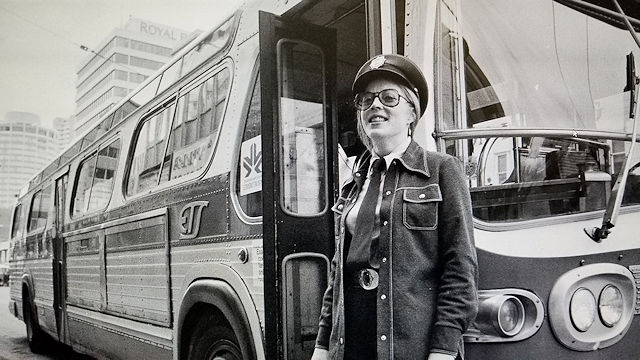 Kathleen Andrews in front of bus