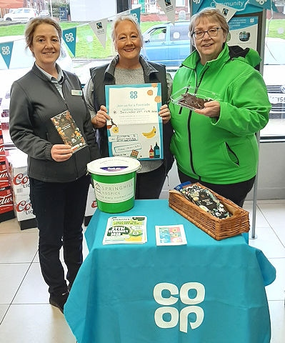 Jane Flynne, the Assistant Store Manager at the Cutgate Store with Barbara Lloyd and Bev Place (centre)