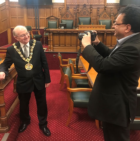 Councillor Iftikhar Ahmed, cabinet member for adult care (right) snaps the Mayor of Rochdale, Councillor Billy Sheerin