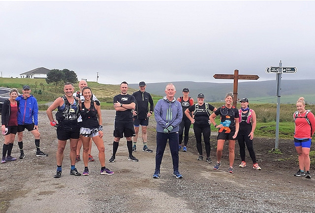 Former race organiser Andy O’Sullivan MBE (centre, grey coat) organised an 'Off Road' Half Marathon for charity