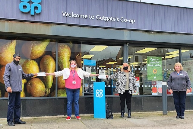 Councillor Rachel Massey (second left) received the donation on behalf of Rochdale in Bloom