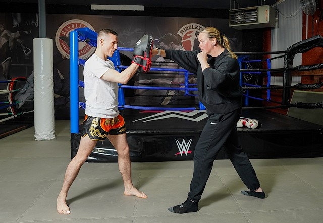 Greg Kubiak puts Councillor Donna Williams through her paces at Middleton Martial Arts Academy.