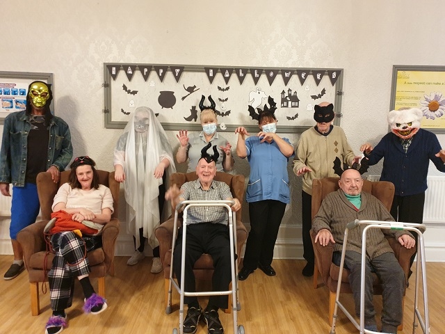 Both residents and staff dressed up before enjoying party food, Halloween bingo and dancing