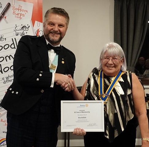 District Governor Eric Russell giving award to President Merrilyn Chadwick