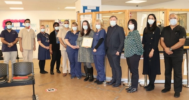 Jenna Johnstone (centre in the grey dress) with the Peterloo team