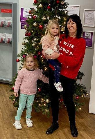 Val was surprised by a visit from her granddaughters, Jessica and Ella