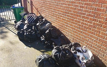 Dumped waste in an alleyway between Abingdon Close and Merefield Street in September 2021