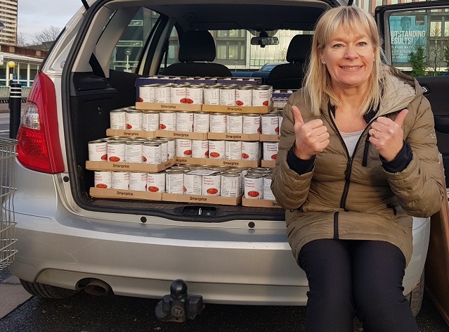 Sue with donations for the foodbank