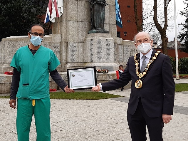 Mayor Billy Sheerin presents a certificate of recognition to Dr Mohammed Zahir (Heywood)