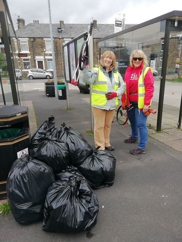 Volunteers took to the streets of Newhey to tidy up litter